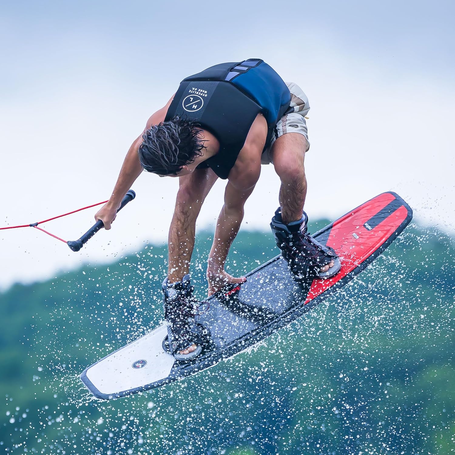 Hyperlite Motive wakeboard with Frequency OSFA bindings featuring continuous rocker and vibrant graphics action