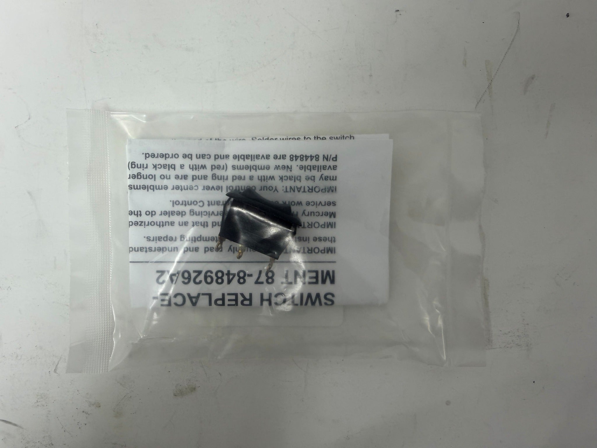 Mercury 848926A2 trim switch kit close-up through package