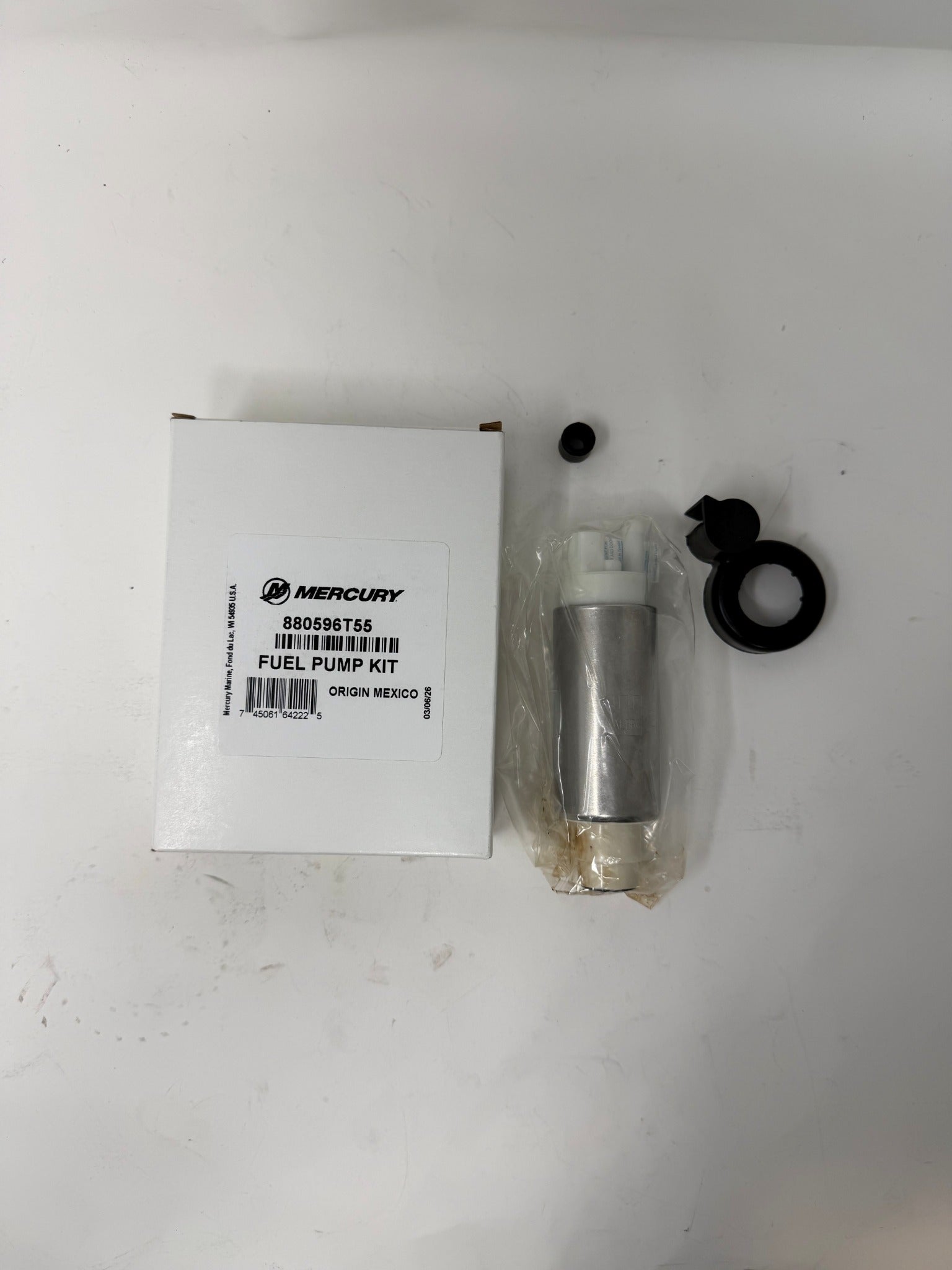 Mercury 880596T55 fuel pump kit top view with box and parts