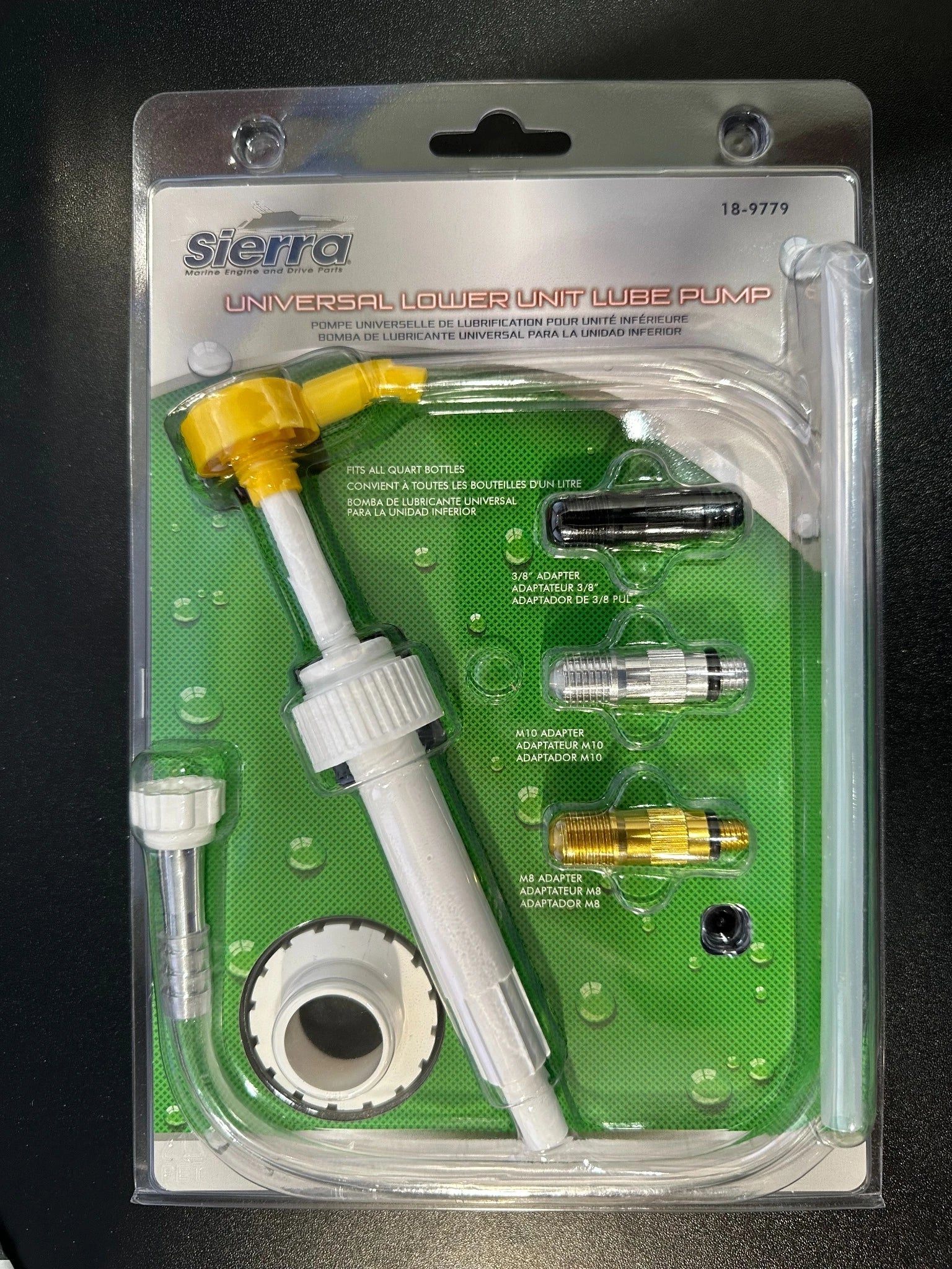 Sierra 18-9779 universal marine gear lube pump with transparent hose and metric adapters for quart bottles in package.