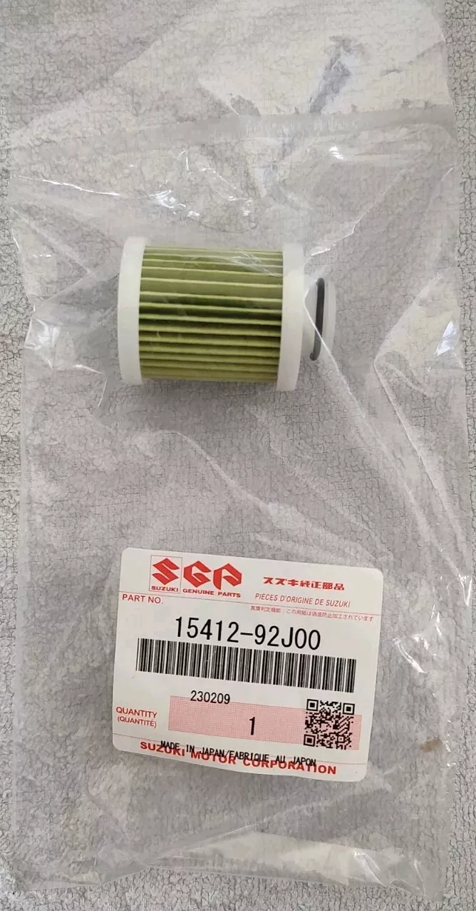 OEM Suzuki Low Pressure Fuel Filter 15412-92J00 packaged in clear plastic, displaying the green filter and white components.